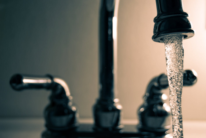 a faucet with dripping water